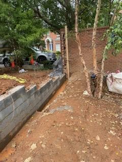 Strategic Home Division: Installing a Fresh Brick Wall for Enhanced Privacy and Distinctive Separation